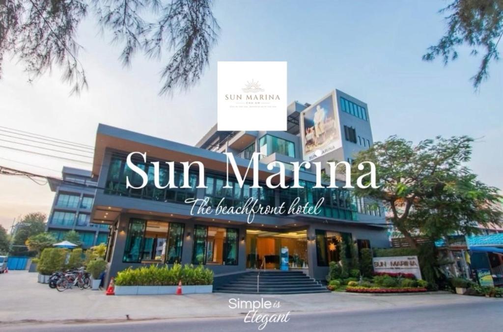 a building with a sign that reads sun marina at Sun Marina Cha-Am in Cha Am