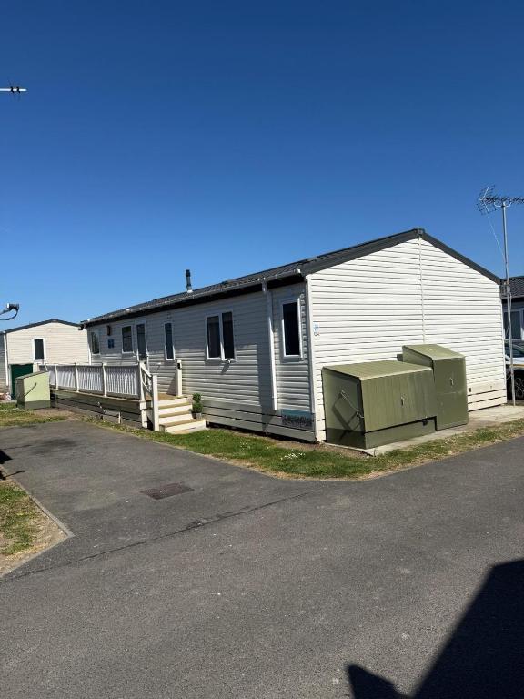 a building with two toilets in front of it at Seaview Holiday Rentals - Pebble Beach in Whitstable