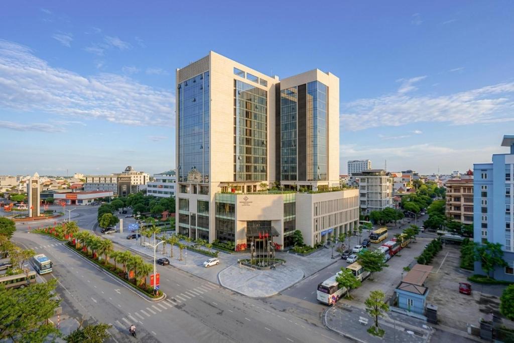 an aerial view of a city with tall buildings at Khách Sạn The Grand Dragon in Móng Cái