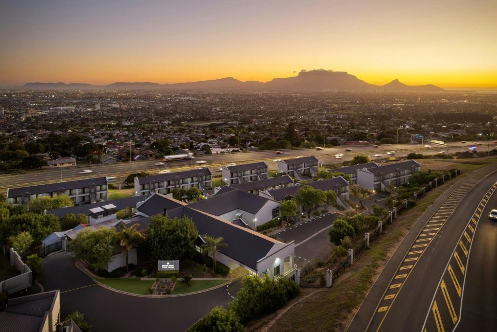 an aerial view of a city with a train station at Protea Hotel by Marriott Cape Town Tyger Valley in Bellville