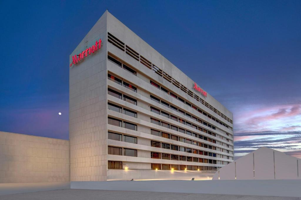a building with a sign on the side of it at Karachi Marriott Hotel in Karachi