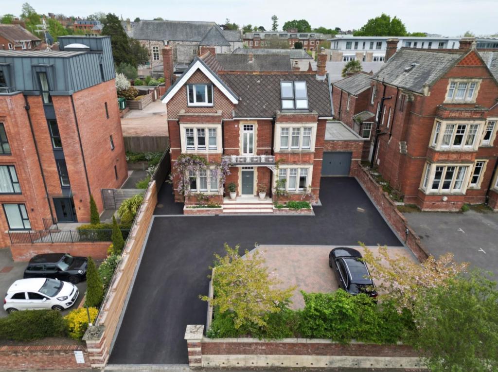 an aerial view of a house with a parking lot at 4 Spicer Road in Exeter