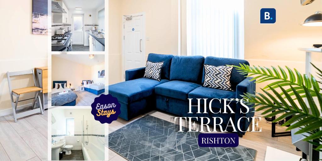 a blue couch in a living room with a kitchen at 3 Bedroom House in Rishton by Eason Stays, Great Location Near Shops & Transport in Rishton