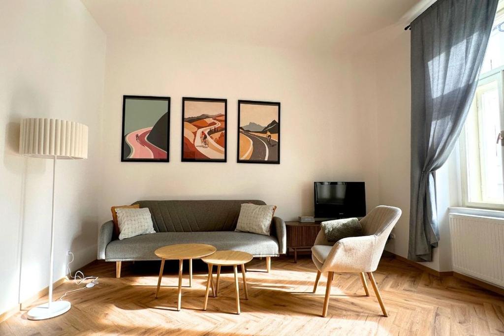 a living room with a couch and a table at Elbe Stay Roudnice in Roudnice nad Labem