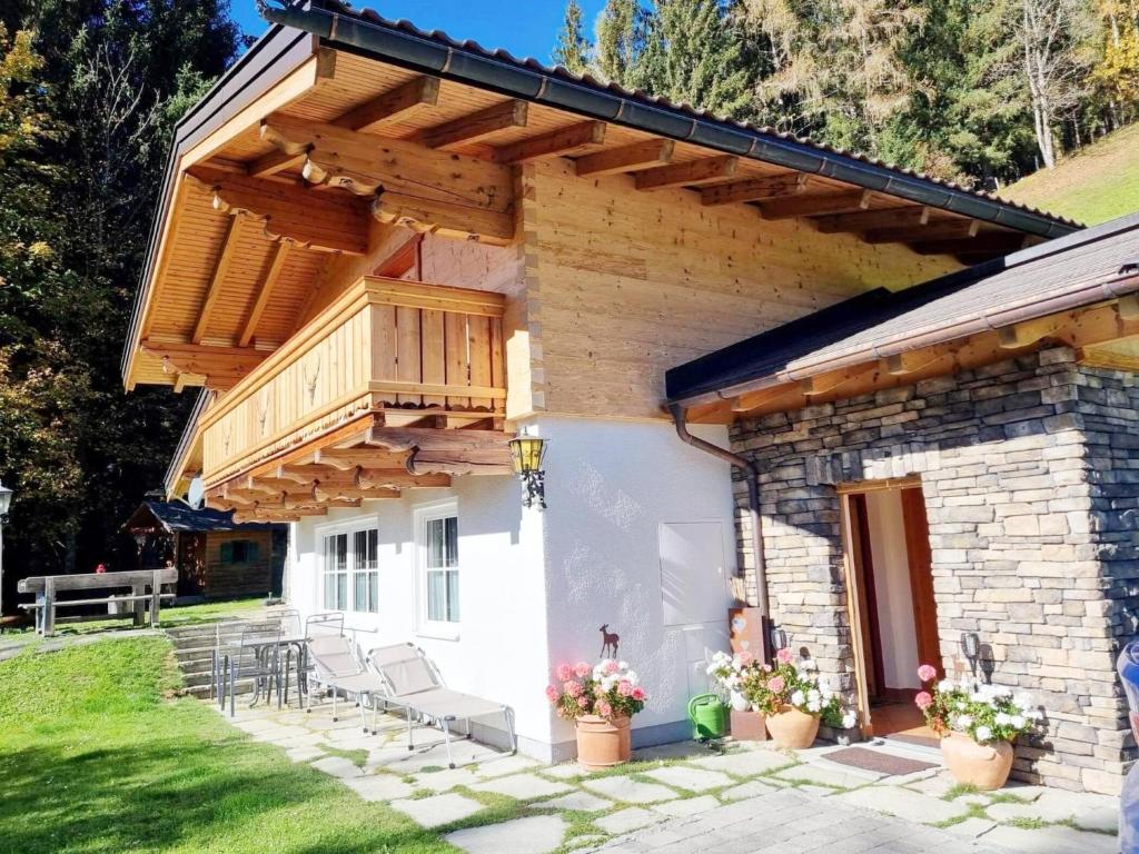 a house with a deck and a patio at Vacation home in Flachau in Flachau
