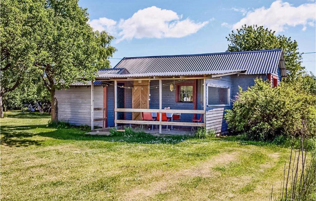 a small house sitting on top of a field at Lasses Stuga in Visby
