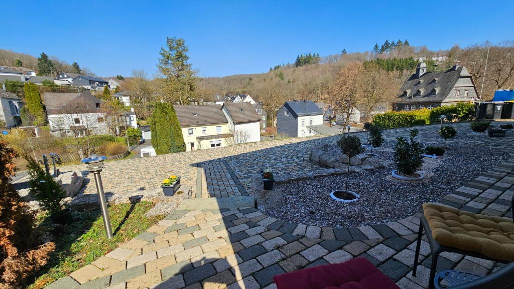a stone patio with a fire pit in the middle at Apartment Wildgrund in Siegen