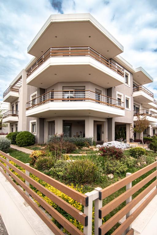 a house with a fence in front of it at Alexandra Boutique Residence VILLAS in Alexandroupoli