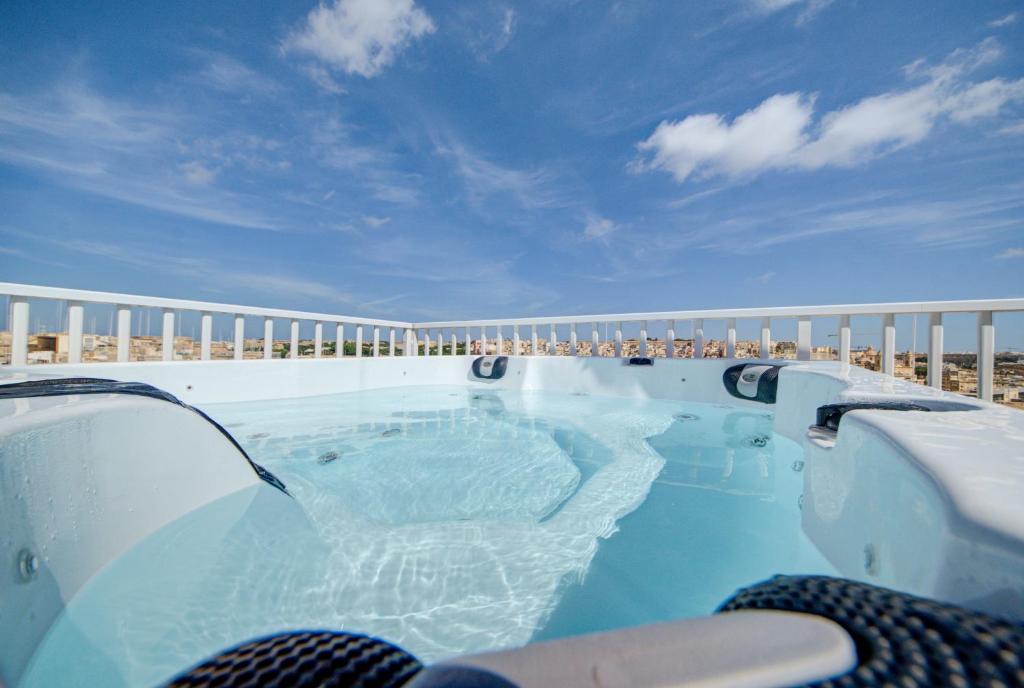 a swimming pool on the side of a resort at The Oasis - R4 in Senglea