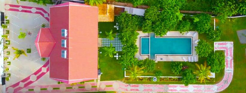 an overhead view of a building with a swimming pool at Even Beach Oasis in Wayikkal