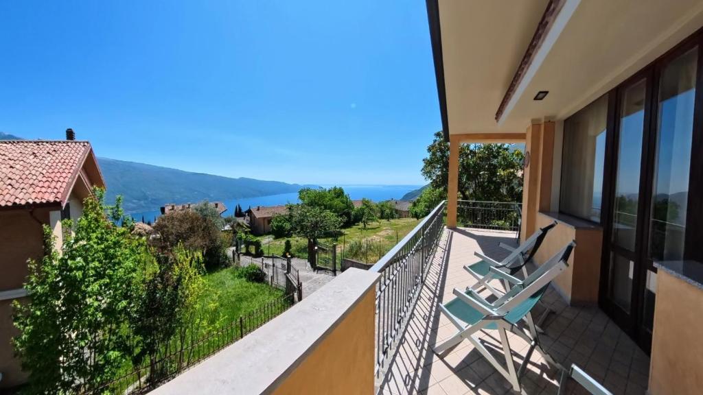 a balcony in a house with a view at Villa Arianna Lake View Apartments with Pool in Tignale