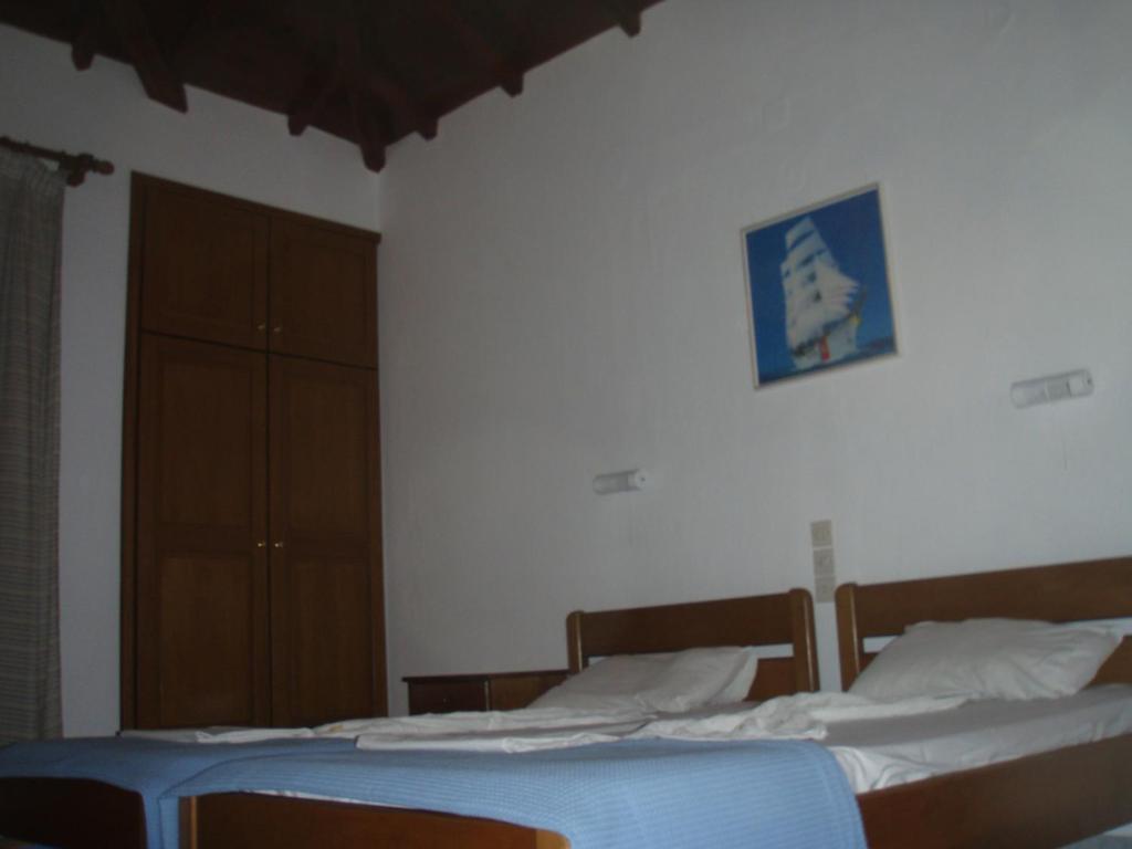 Postel nebo postele na pokoji v ubytování Eros-Iros Portside Stays Skiathos