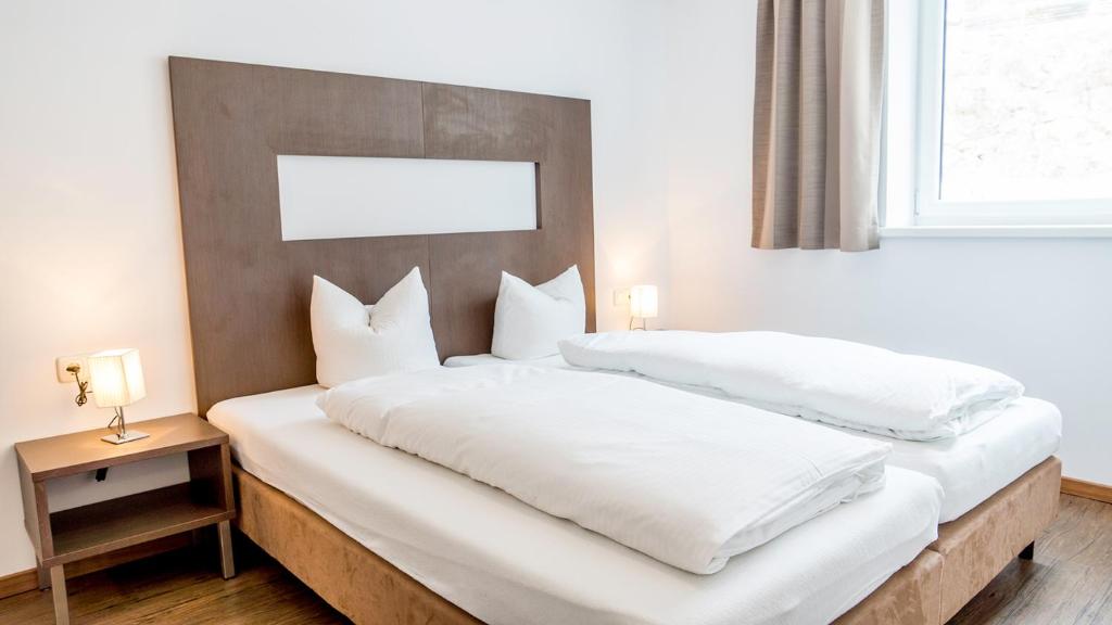 A bed or beds in a room at Haus Steissbach