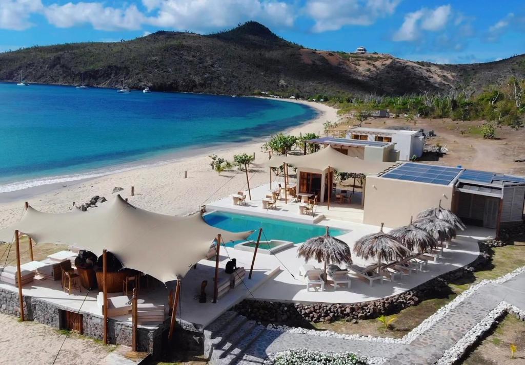 an aerial view of a beach with a resort at Tenuta Chatham Bay in Union Island