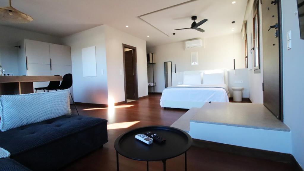 a living room with a couch and a table at Ianos Living Spaces - 01 in Korinthos