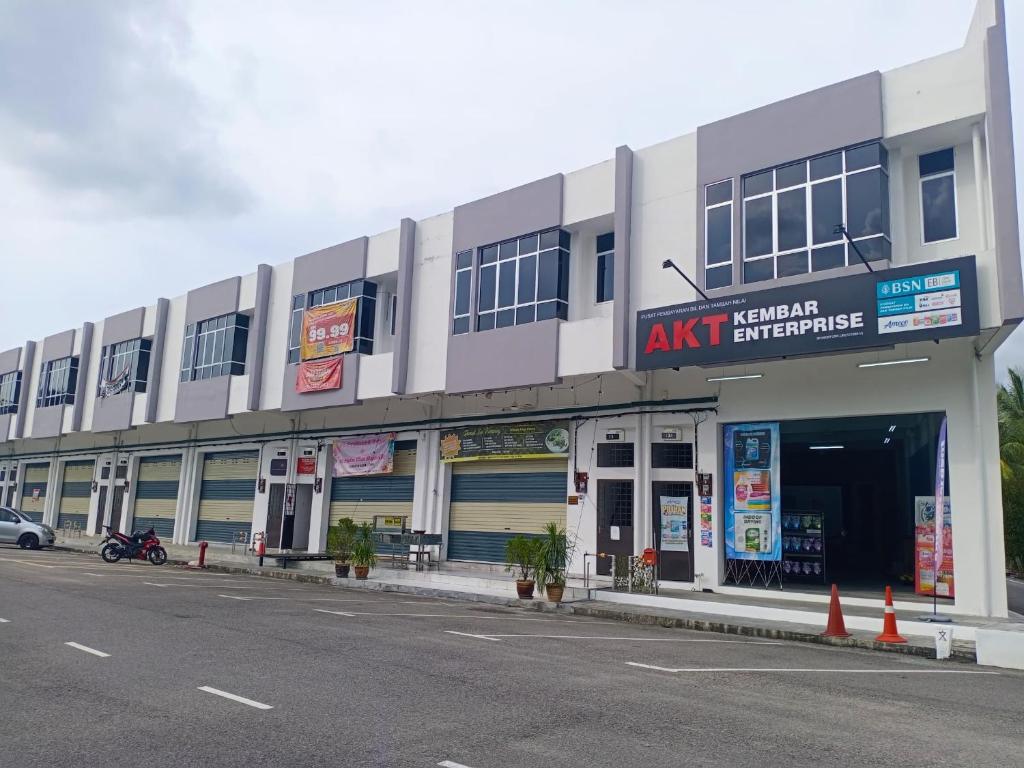 a large building with an akhtar entrance on a street at Tetiba Suite in Muar