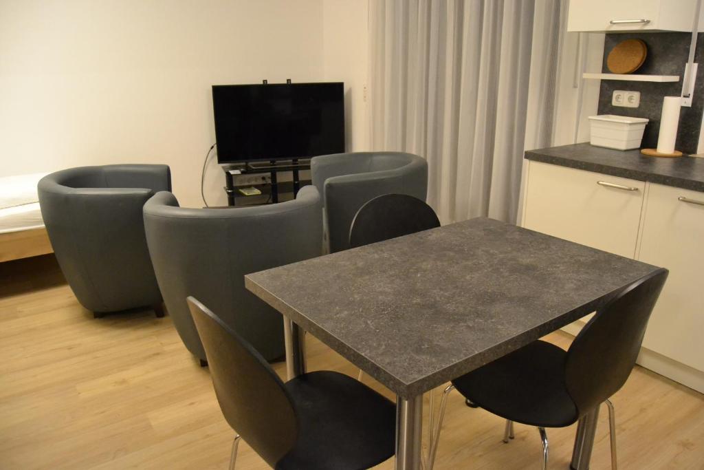 TV a/nebo společenská místnost v ubytování Aparthotel Sebastian