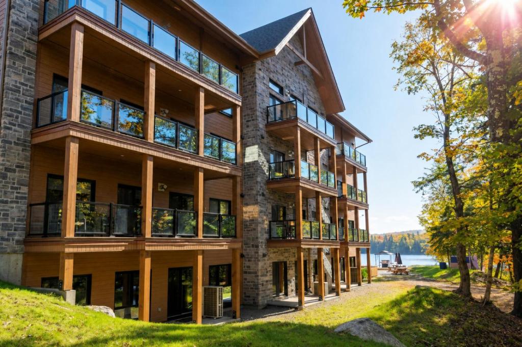 an apartment building with a view of the water at Château Morritt in Mont-Tremblant