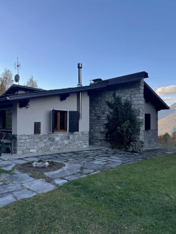 a house with a cross on top of it at Chalet il pino in San Bernardo