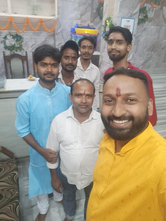 a group of men posing for a picture at Vandana Hotel in Dehri
