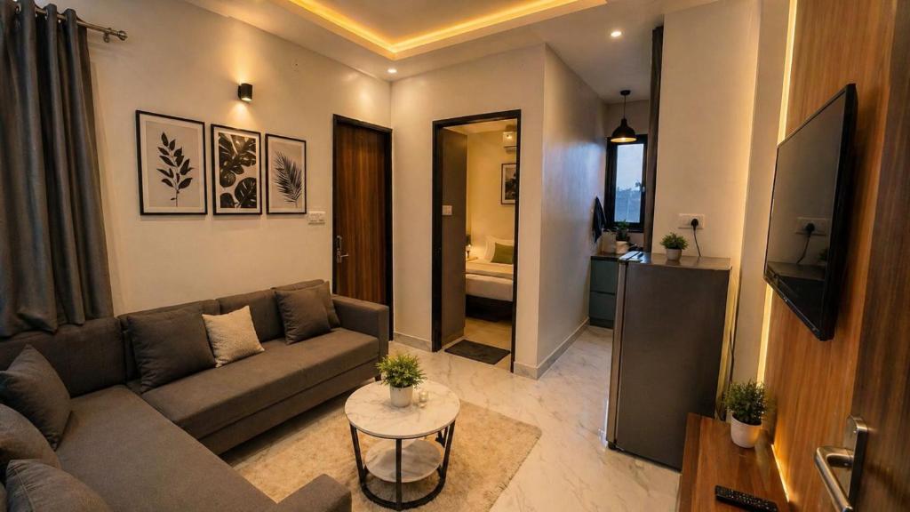 a living room with a couch and a table at Lado by Stay Junction in Indore