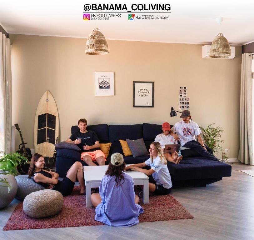 a group of people sitting in a living room at Banama Surfhouse - Coliving Coworking & Yoga in Corralejo