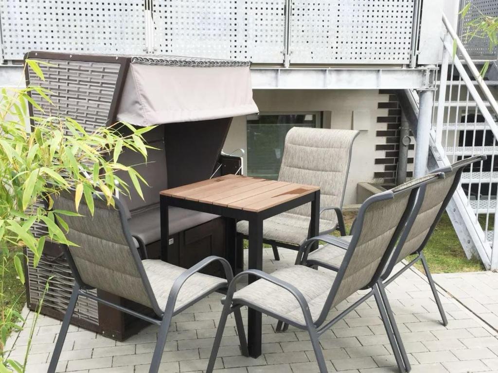 a table and chairs sitting on a patio at Mariehus in Wangerooge