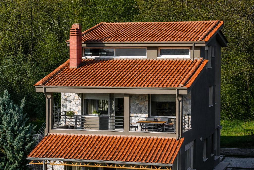 a house with an orange tiled roof at VALLEY Premium House in Serres