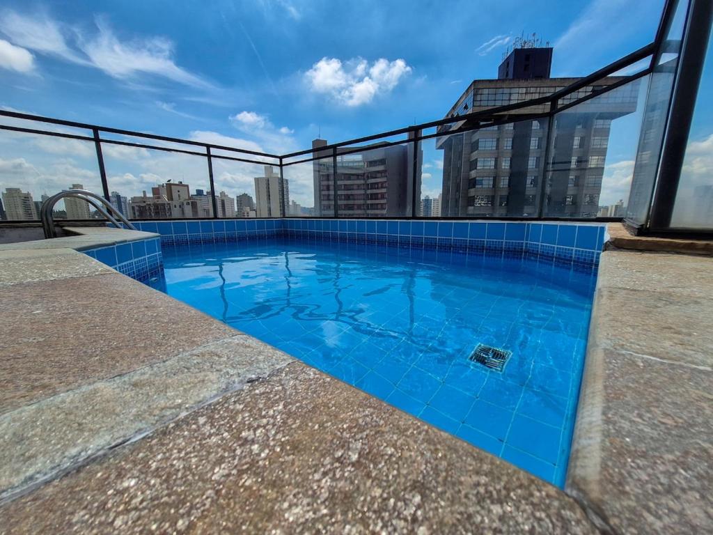 a swimming pool on the roof of a building at Apartment 116 - Jundiaí in Jundiaí