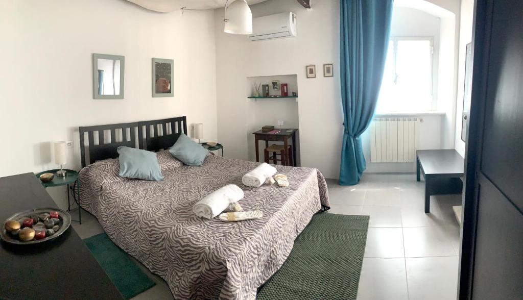 a bedroom with a bed with stuffed animals on it at CiroMenotti62 in Marina di Carrara
