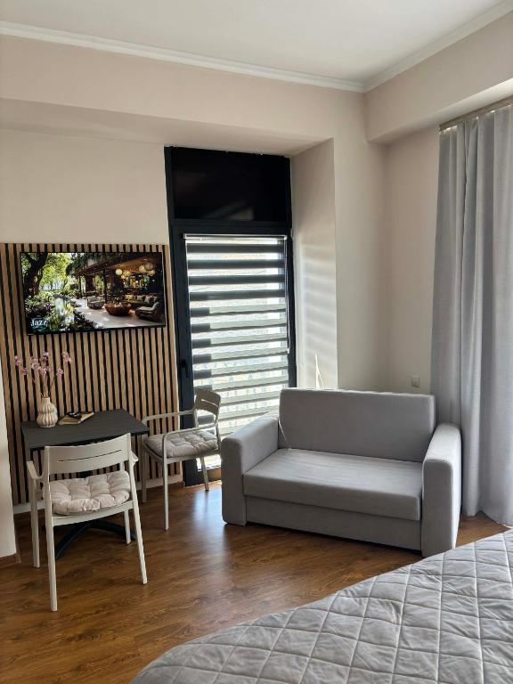 a living room with a couch and a table at Alvina 29 in Tsaghkadzor