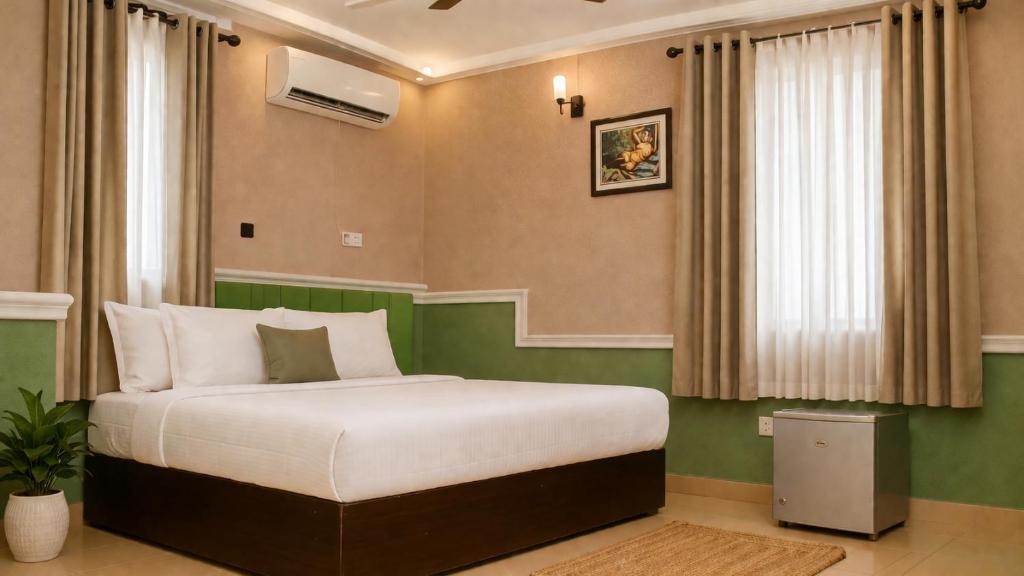 a bedroom with a large bed in a room at DeBoss Hotel in Ikeja
