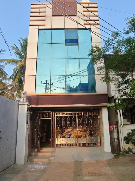 a building with a gate in front of it at Kanchi grace cottage in Kanchipuram