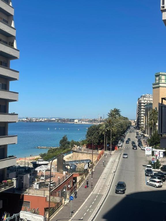 a view of a city street with the ocean at Casa Boccardi in Taranto