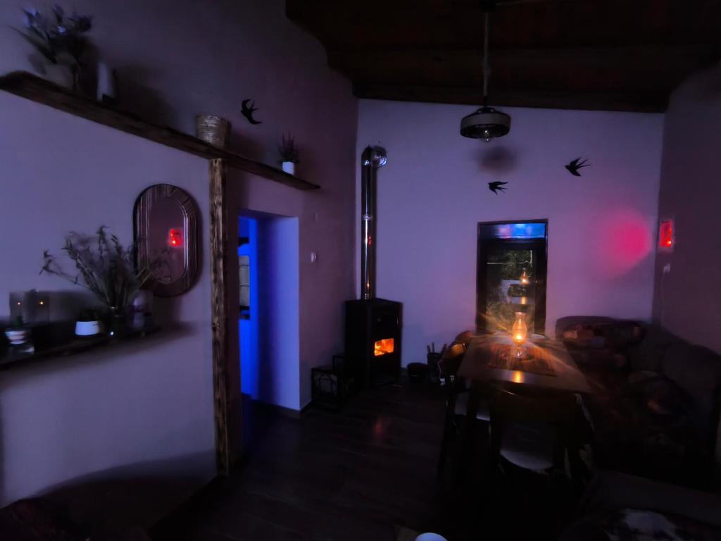 a living room with a fish tank in a purple room at Helidoni in Margarítai