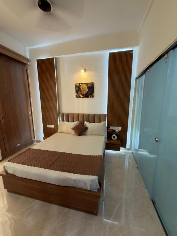 a bedroom with a large bed in a room at The Orion Nest in Noida