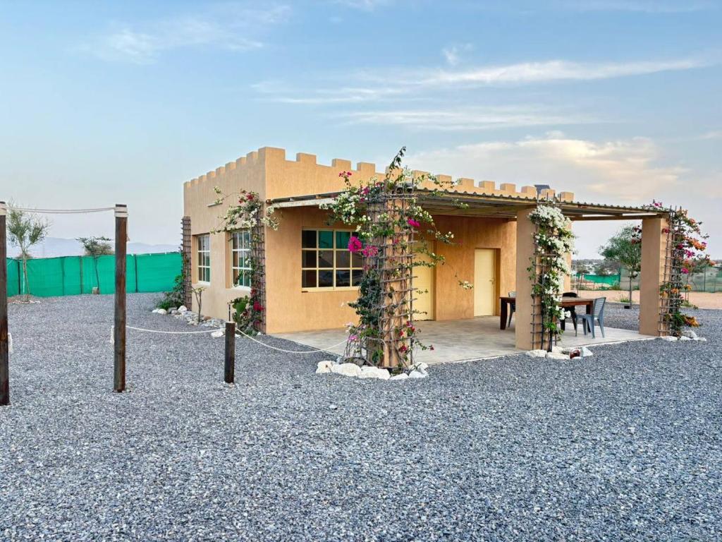 a building with a table in front of it at thedesert08 in Ras al Khaimah