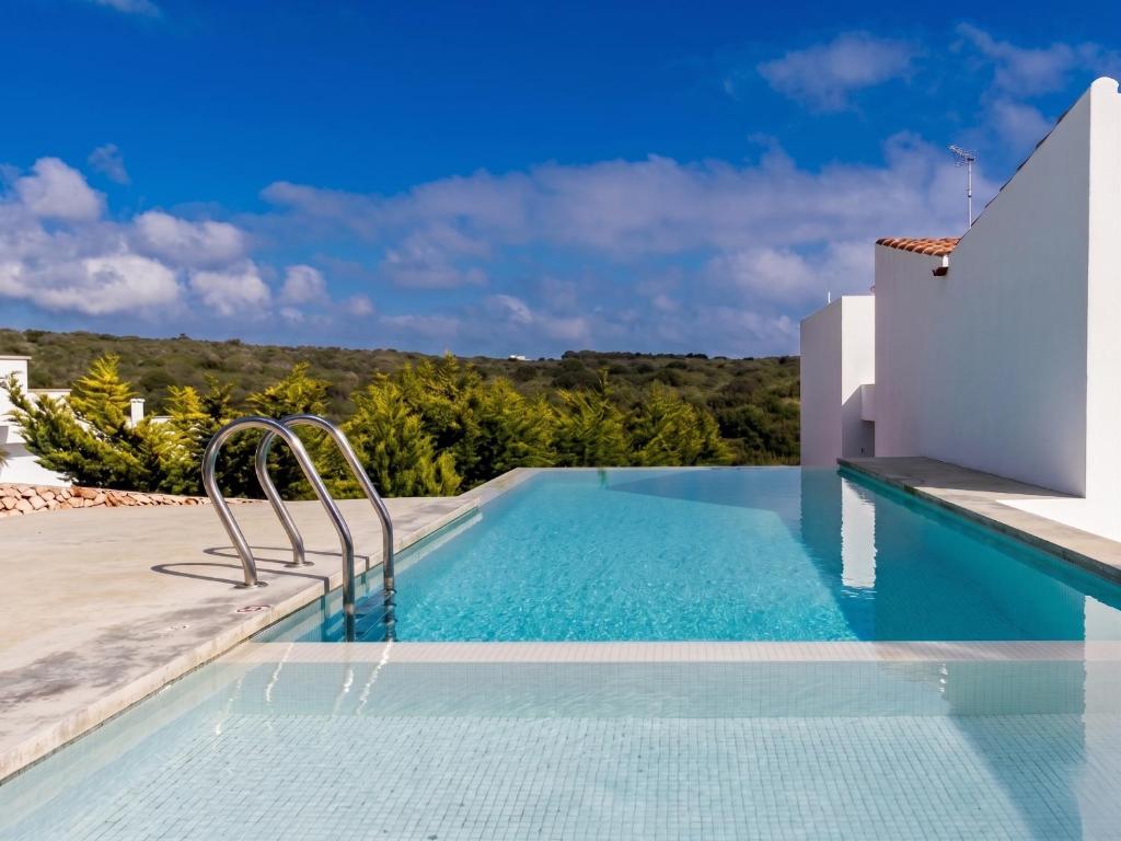 a pool at a villa with a view at Apartamento Binibeca Nou Cami de Cavalls in Binibeca