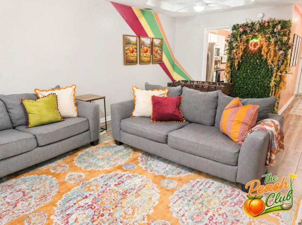 a living room with two couches and a rug at luxury condo, pet friendly, close to everything in Augusta