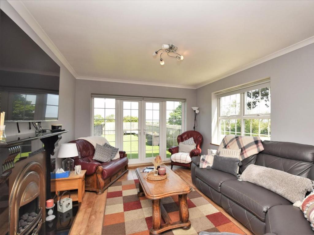 a living room with a couch and a table at 2 Bed in Morpeth oc-36925 in Widdrington