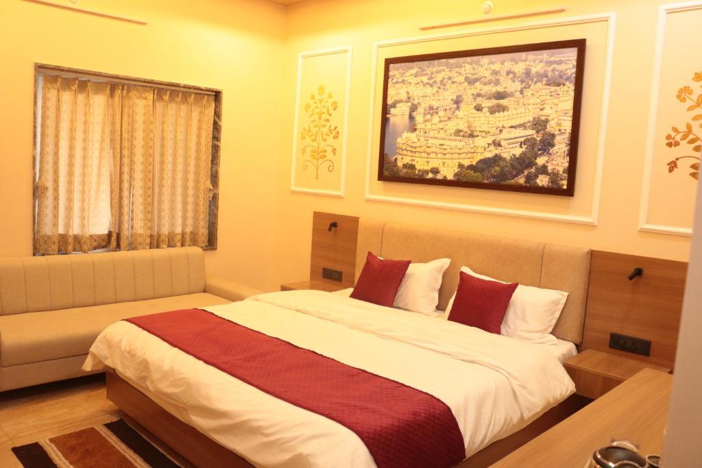 a bedroom with a large bed and a window at Hotel Kalptaru Villas in Debāri
