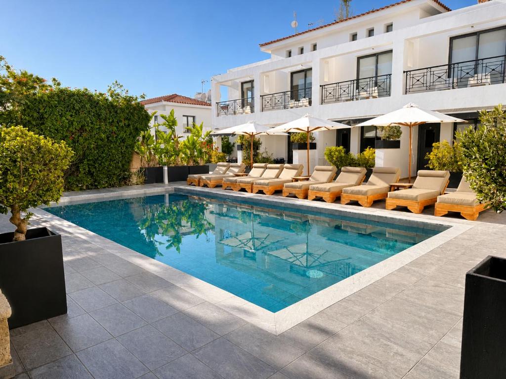 an image of a swimming pool at a hotel at Julipapas Gardens in Paphos