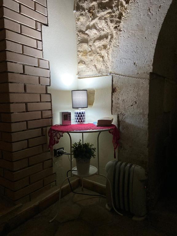 a room with a table with a computer on it at Bentivegna Apartments in Syracuse