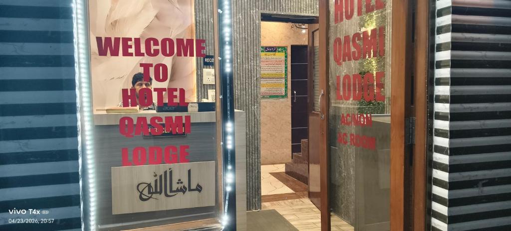 a door to a store with a welcome to hell sign at Qasmi Hotel in Jammu