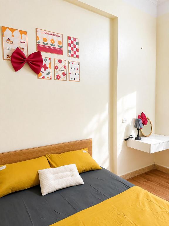 a bedroom with a bed with a red bow on it at Lapausa Homestay in Kỳ Vĩ