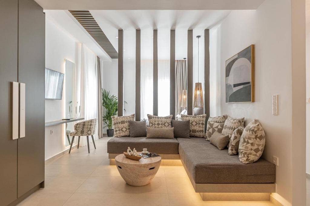 a living room with a couch and a table at Rafaela Casa Luxury Apartment Naxos in Naxos Chora