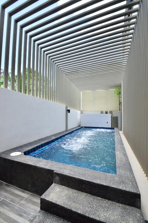 a swimming pool in a building with a ceiling at Iris Luxury Service Villa in George Town