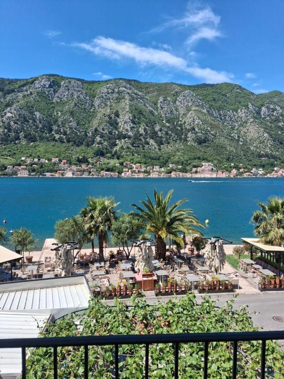 a view of a body of water with mountains at Guesthouse Anita in Kotor