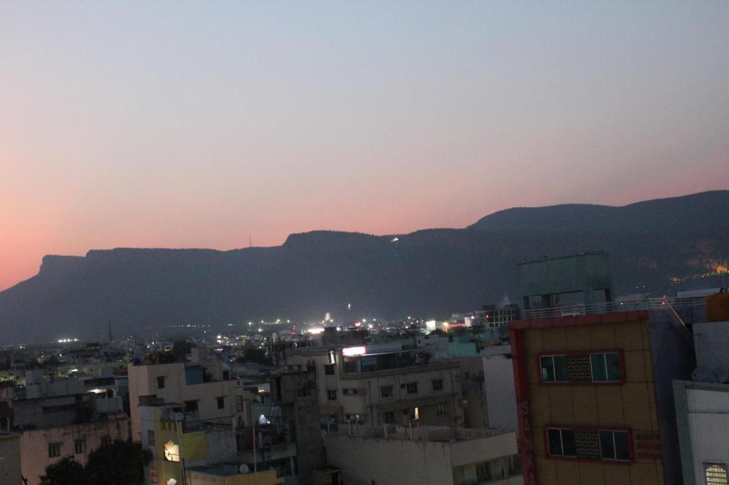 a view of a city with mountains in the background at Hotel GVP Residency in Tirupati