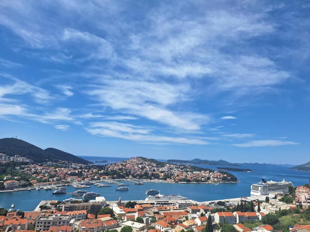 a view of a city with boats in the water at Pansion Panorama Dubrovnik's Most Beatiful Sea View in Dubrovnik